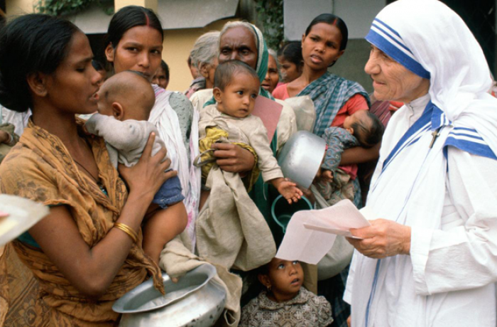 A pricture of Mother Teresa showing us how to help the poor. 
